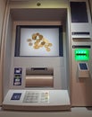 ATM cash money withdrawal machine with coins illustrated