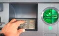 ATM close-up with male hand Royalty Free Stock Photo