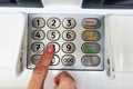 ATM, female hand dials the pin of a credit card at an ATM Royalty Free Stock Photo