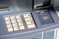 ATM keyboard with plastic buttons for pin code entry with numbers and letters. Card insert slot and contactless near field
