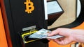 Atm machine bitcoin cryptocurrency. Usd hundred money payment on virtual crypto currency btc wallet. Woman withdraw