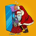 ATM pours out money, Santa Claus gets a Christmas holiday bonus Royalty Free Stock Photo