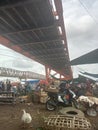 the atmosphere and activities under the Musi 2 Bridge in Palembang, namely the traditional market