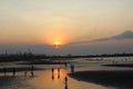 Atmosphere beach sunset time many silhouettes of people playing on the shore