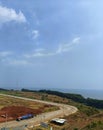 the atmosphere of the beauty of the road and mountains along with the blue sky, Semarang, Indonesia