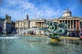 The atmosphere at the fountain in Trafalgar Square in front of National Gallery museum in London, England, UK