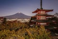 Atmosphere at full moon at Chureito Pagoda and Mount Fuji with Fujiyoshida night lights in autumn Royalty Free Stock Photo