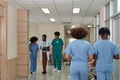 Atmosphere of a hospital, groups of doctors and medical students talk and walk Royalty Free Stock Photo