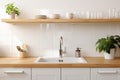 The atmosphere of a modern kitchen is reflected in the layout that combines a luxurious sink with shelves displaying well- Royalty Free Stock Photo