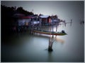 The atmosphere before sunset in the fishing village by the lake Royalty Free Stock Photo