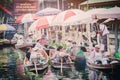 The atmosphere of trading goods and food, on vintage boats at Tha Kha Floating Market