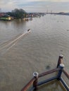 The atmosphere of transportation activities on the Musi River seen from the Musi Empat bridge