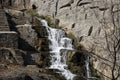 A small waterfall among the stones Royalty Free Stock Photo