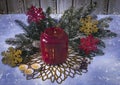 Atmospheric Christmas candle holder with candles, with fir branches, Christmas balls and decorative snowflakes. Royalty Free Stock Photo