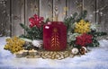 Atmospheric Christmas candle holder with candles, with fir branches, Christmas balls and decorative snowflakes Royalty Free Stock Photo