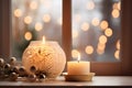 Atmospheric Christmas window sill decoration with white candle burning