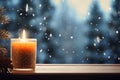 Atmospheric Christmas window sill decoration with white candle burning