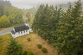 Aerial View of a Little White Church on a Foggy Morning.