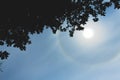 Atmospheric optical effect circle around the sun on hot summer day. Atmospheric halo phenomenon around the sun