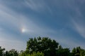 atmospheric optical phenomena. Iridescent clouds with blue sky Royalty Free Stock Photo
