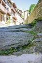 On the atmospheric paved street and Rustic house in the medieval village of Rupit in the mountainous part Catalonia. Spain