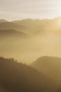 Atmospheric perspective during sunrise/sunset (mist and fog on hills) Royalty Free Stock Photo