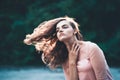 Atmospheric portrait of young beautiful woman, long hair and casual makeup