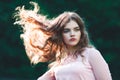 Atmospheric portrait of young beautiful woman, long hair and casual makeup