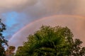 Atmospheric Rainbow Arcing through Broken Clouds Royalty Free Stock Photo