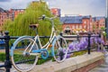 Atmospheric scene of a parked bicycle at the restored Victorian canal system in Castlefield area of Manchester