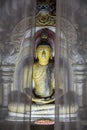 Atmospheric shot of a shrine behind curtains of one of the many sculptures of buddha inside Dambulla cave temple. Also known as th Royalty Free Stock Photo