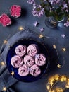 Violet sweet Zephyr Marshmallow near lilac flowers and stars lights