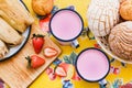 Atole de fresa, mexican traditional beverage and bread, Made with cinnamon and strawberries in Mexico