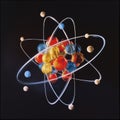 Atomic dance: subatomic realm, electrons, neutrons, and protons orbit a fixed nucleus in a model empty space within