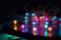 Atomic structure with electrons, protons, and neutrons replaced by technological elements like chips, wires, and glowing diodes.