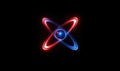 Atomic structure illustration with glowing red and blue rings around central nucleus Royalty Free Stock Photo