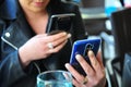 Atractive woman typing on a smartphone