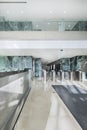 Atrium of an office building with green marble tiling on the walls, cream marble floors and turnstiles for access control Royalty Free Stock Photo