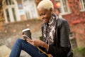 Atrractive african american woman in autumn park Royalty Free Stock Photo