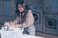 Atrractive girl with a basket in laundry