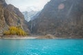 Attabad lake in autumn against snow capped mountain in Karakoram range. Royalty Free Stock Photo