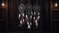 3 attache dWhite dream catcher with feather hanging at black wooden background