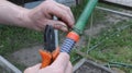 Attaching the wire clamp to the garden hose