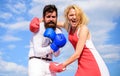 Attack is best defence. Relations family life as everyday struggle. Man and woman fight boxing gloves sky background