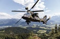 Attack helicopter flies over german landscape