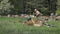 Attacking soldier vith helmet and rifle on the ground, frontal attack of Russian infantry, second world war reconstruction.