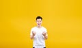 Attactive young asian man fury and angry negative emotion wearing white t-shirt