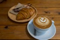 Atte art coffee cup and croissant