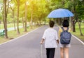 Attempt elderly asian woman walking to do workout with stick at public park,Daughter take care and support