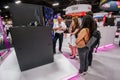 Attendees listen stand-attendant at Intel booth of exhibition